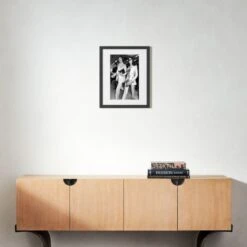 'Mick And Bianca At The London Airport, 1970' Photographic Print In Black Frame 17.5"x21.5" -Optimal Furniture Store SEMickNBiancaBlk21p5x17p5S22 3D